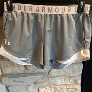 Grey and white Under armor athletic shorts